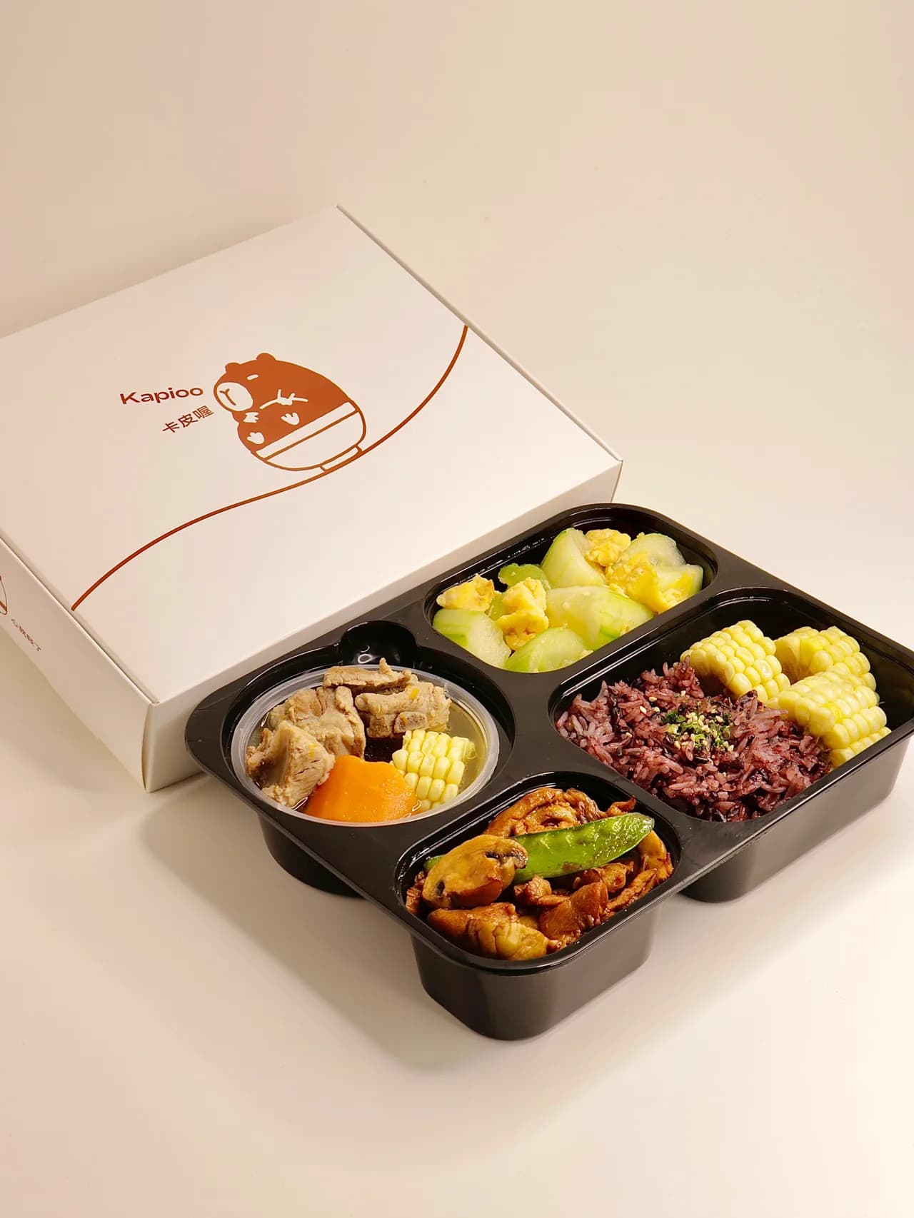 Kapioo Daily Bento with freshly cooked dishes and branded packaging